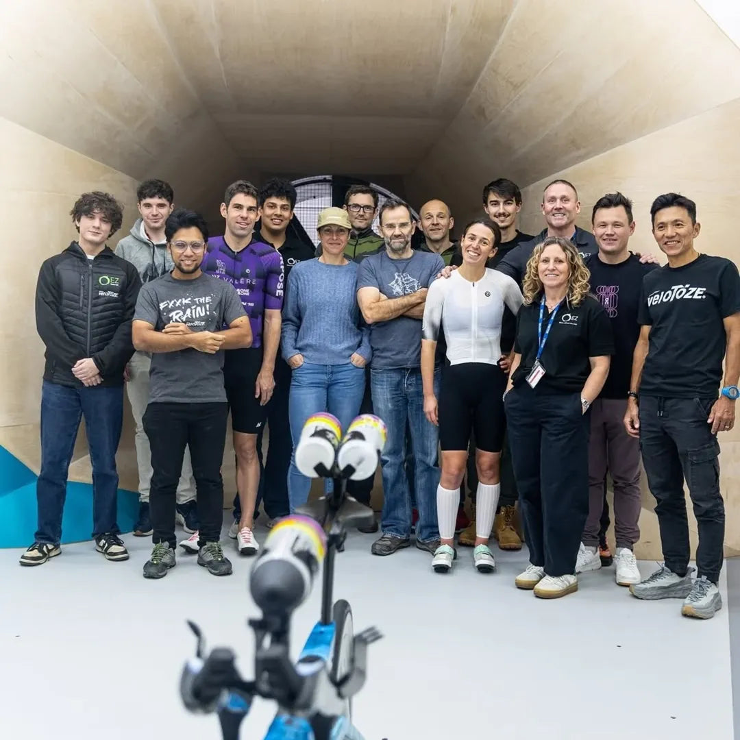 A diverse group of people posing together for a team photo indoors.