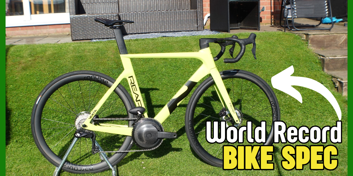 Aerodynamic yellow triathlon bike with disc wheels and carbon components on grass